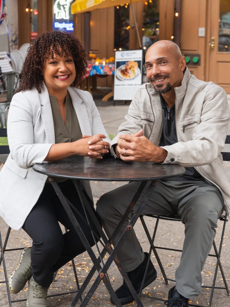 Raphael and Liz St. James at outdoor cafe - contact H2P Collective for transformation coaching